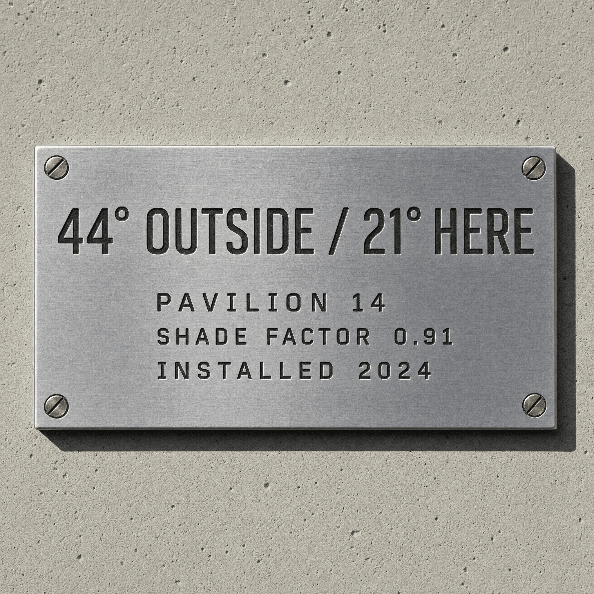 Engraved brushed steel data plate reading 44 degrees outside, 21 degrees here