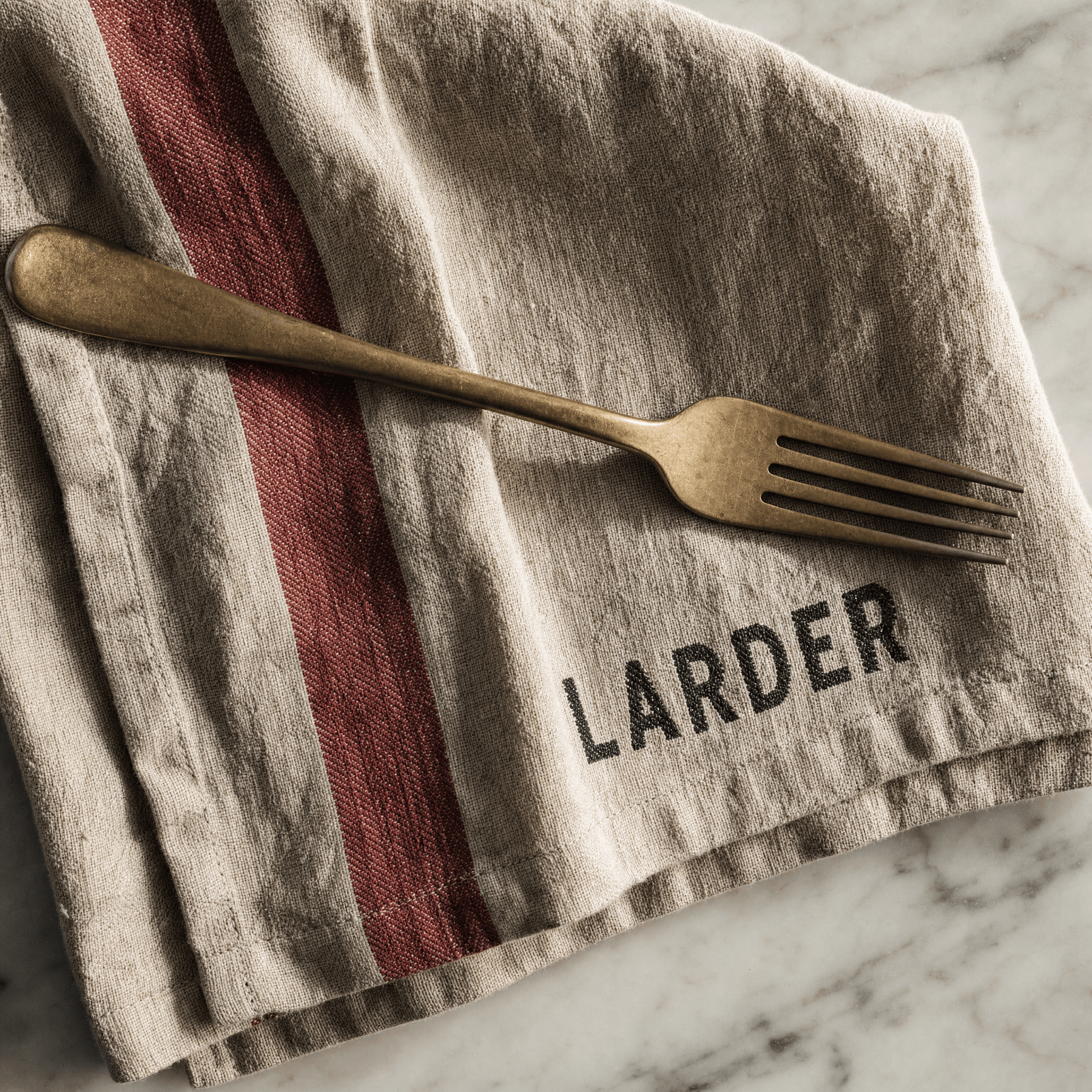 Larder linen napkin, wordmark woven into the hem