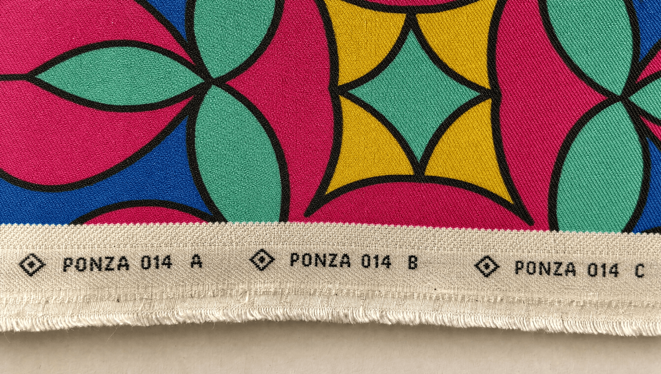 Woven selvedge edge repeating the Ponza print reference