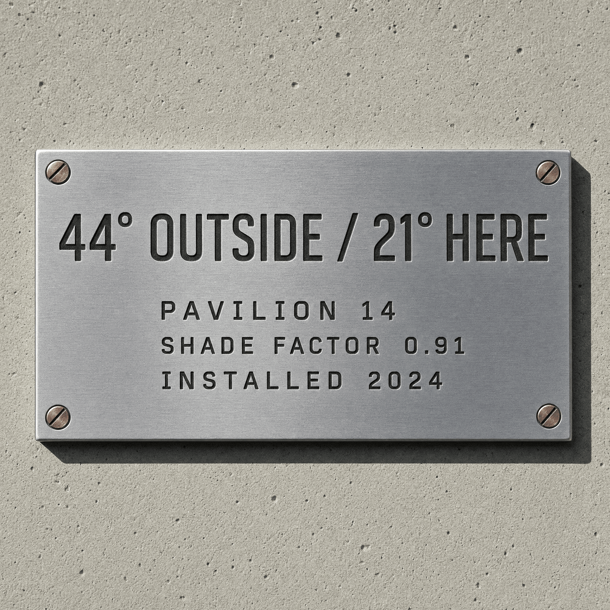 Engraved brushed steel data plate reading 44 degrees outside, 21 degrees here